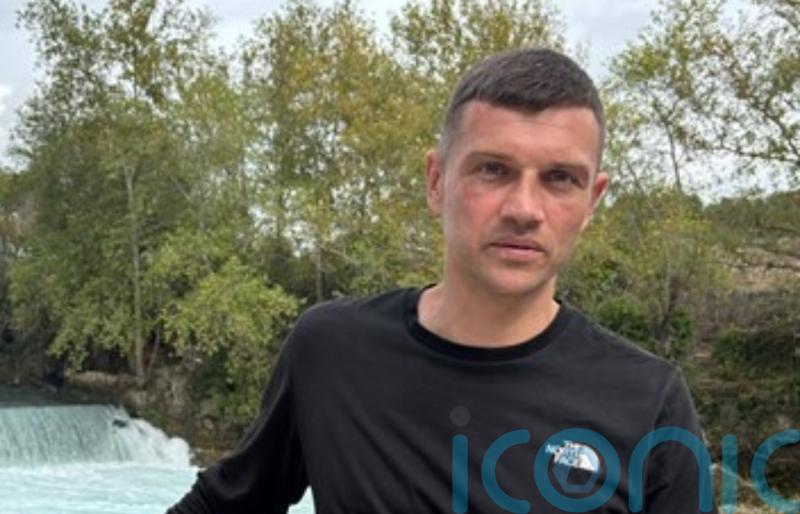 Police name &lsquo;much loved father&rsquo; who died after street incident as two charged