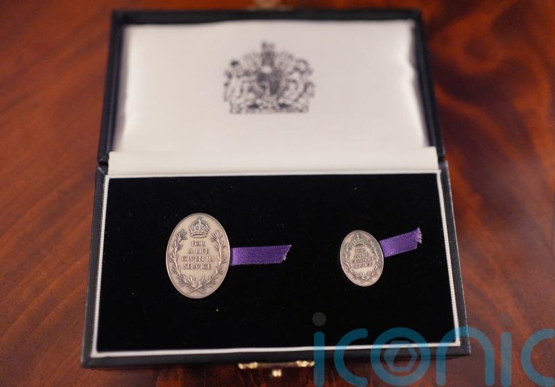 Family of 21-year-old paramedic who died in ambulance crash honoured by the King