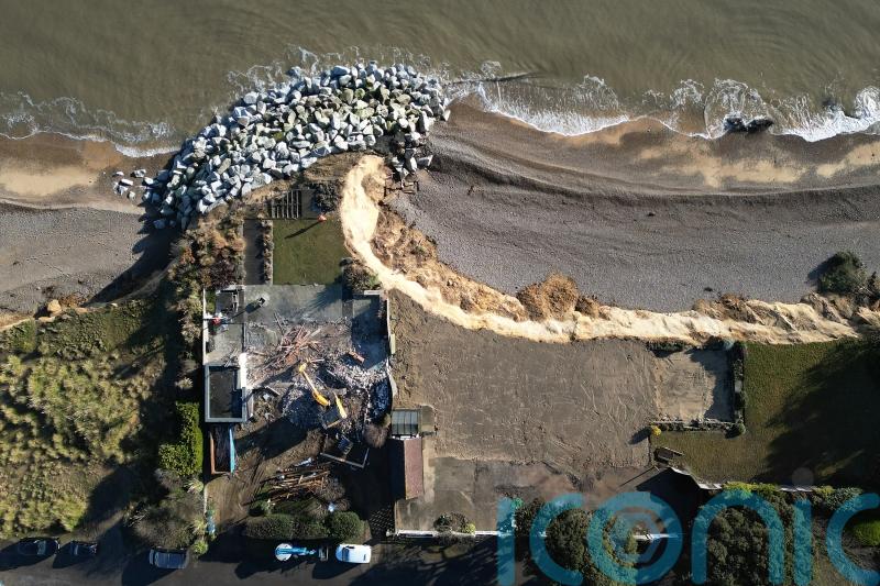 Aerial images show demolition of fourth clifftop home amid coastal erosion