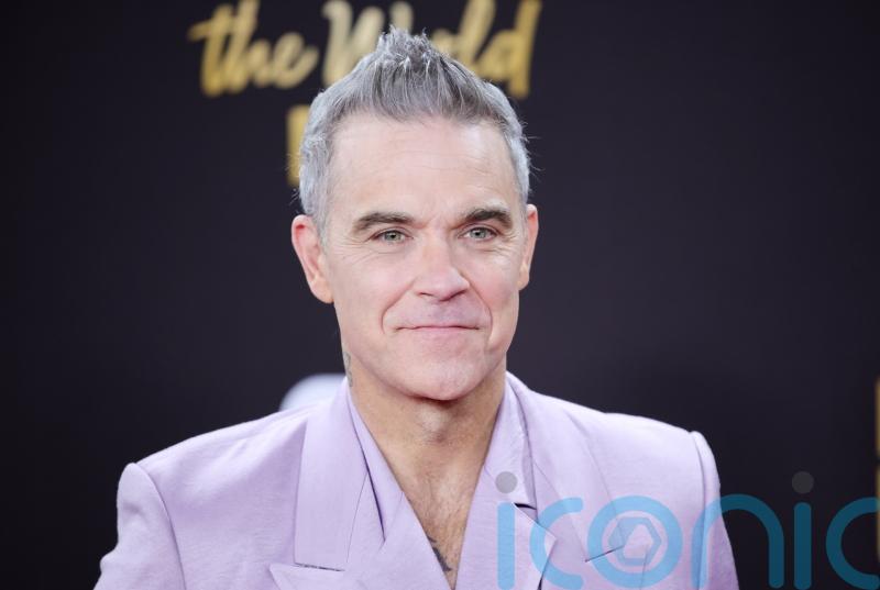 Robbie Williams on track to break The Beatles&rsquo; record for number one albums