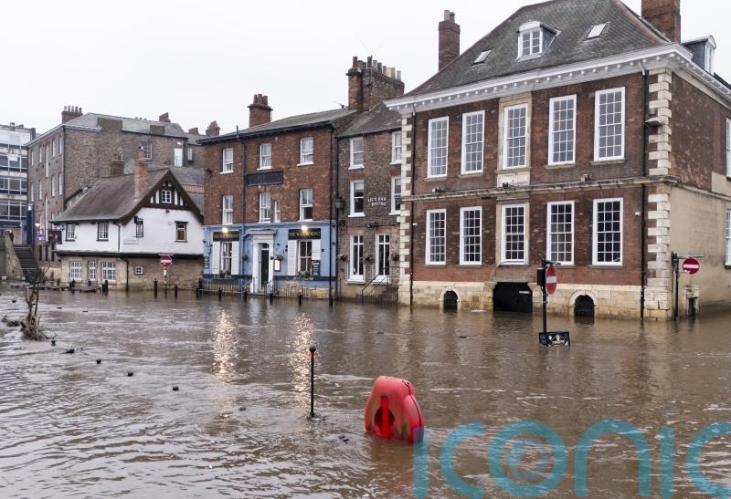 Police search for missing kayaker as heavy rain sparks flood warnings