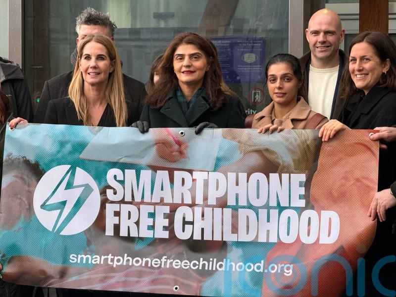 Ban phones in schools to protect children from online dangers, parents urge