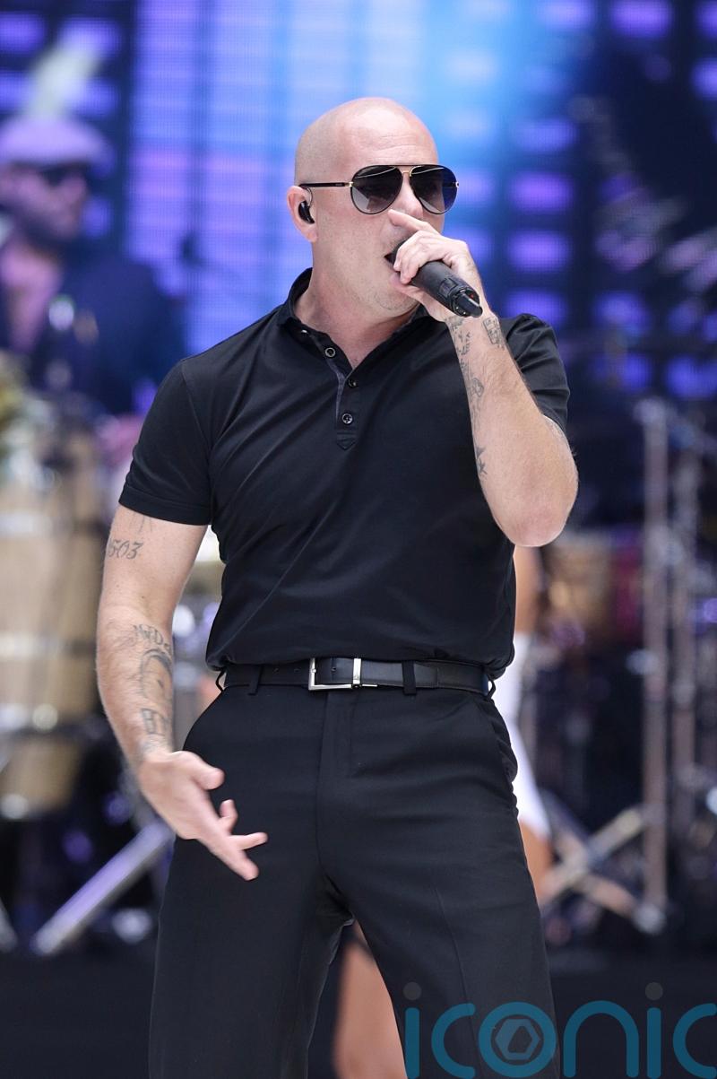 Pitbull to try to break record for largest gathering of people wearing bald cap