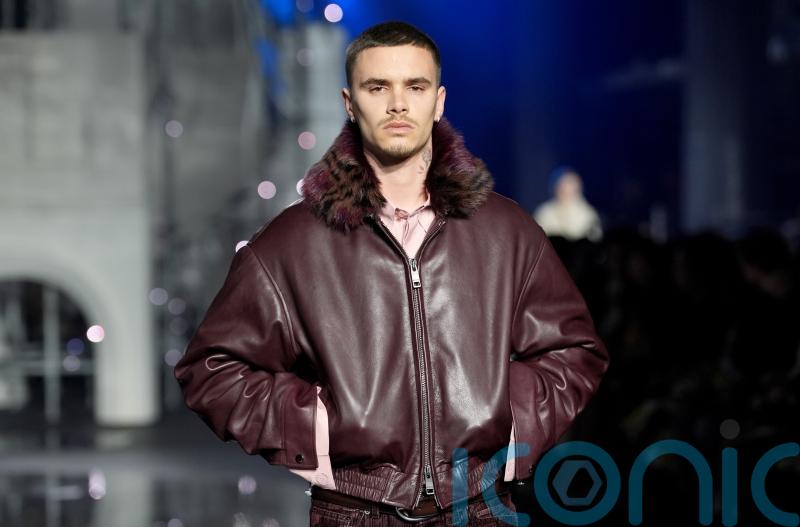 Romeo Beckham and Rosie Huntington-Whiteley walk in Burberry to close London Fashion Week