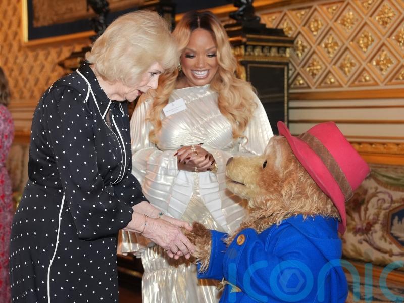 Queen and Paddington Bear share marmalade sandwiches at star-studded reception