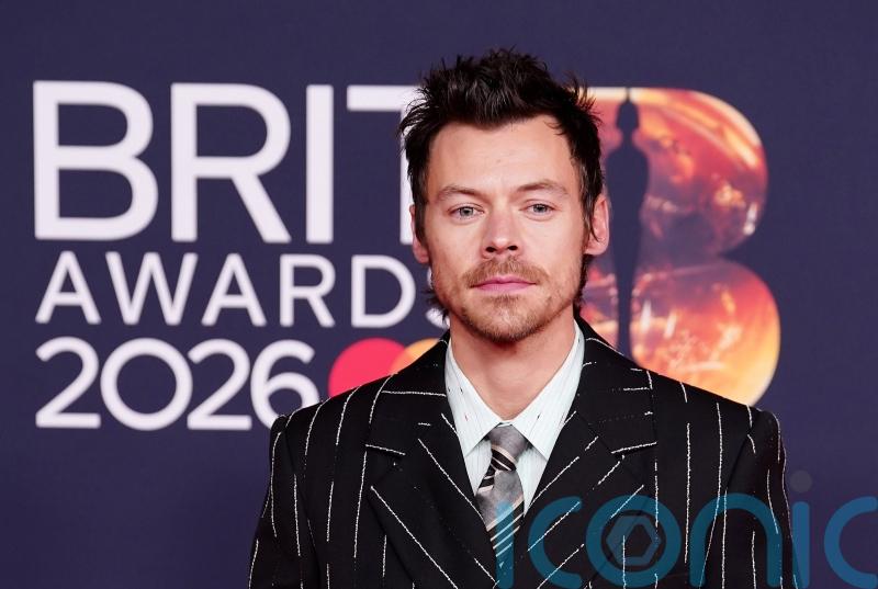 Florals, feathers and colour flashes on glittering Brits red carpet