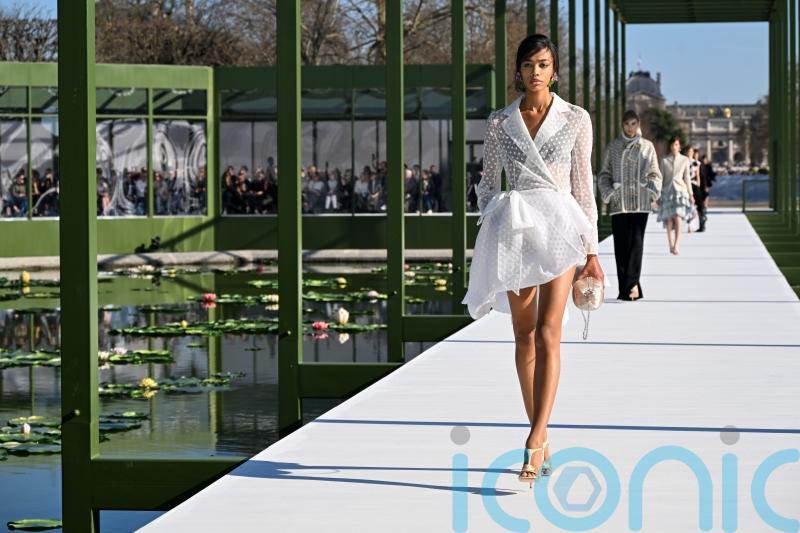 Dior blooms with peplums, bustles and waterlily florals in Paris Fashion Week show