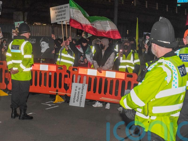 Vigil held for Iran&rsquo;s Khamenei as counter-protesters gather nearby