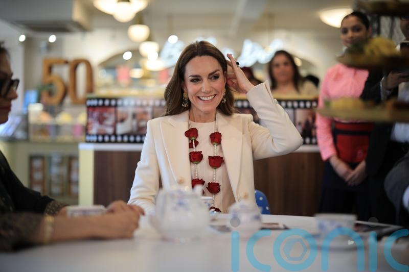 Spice girl: Kate proves partial to a chilli chutney as she meets restaurant team
