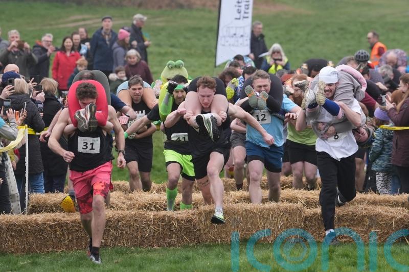 Will you carry me? Couples dash to be crowned winners of UK Wife Carrying Race