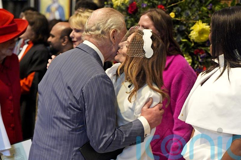 Former Spice Girl plants a kiss on the King at Commonwealth Day service