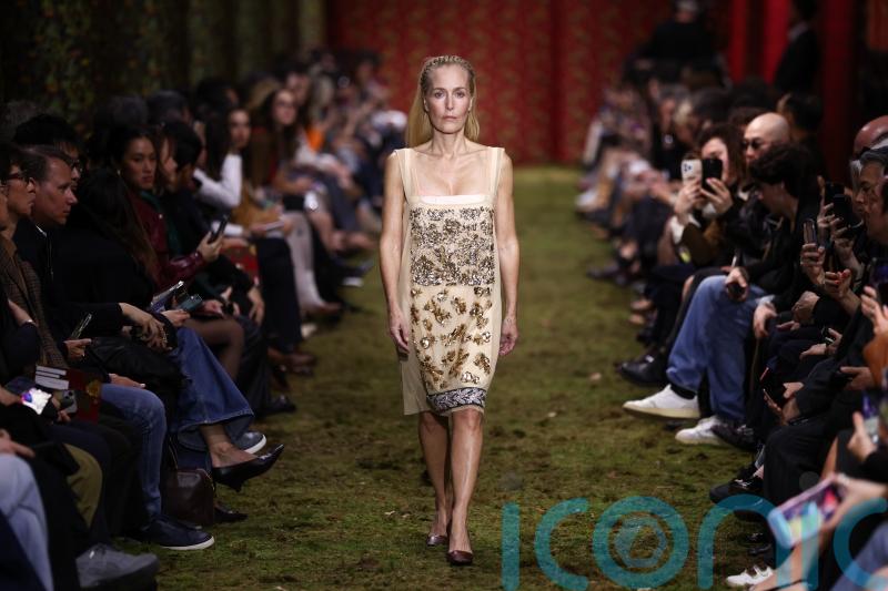 Gillian Anderson struts down Paris Fashion Week runway on final day