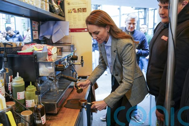 Kate makes cappuccino for William during Borough Market visit