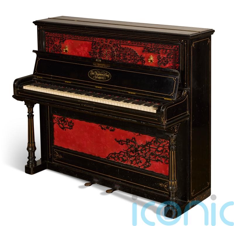 Piano John Lennon used to write Beatles songs fetches record amount at auction