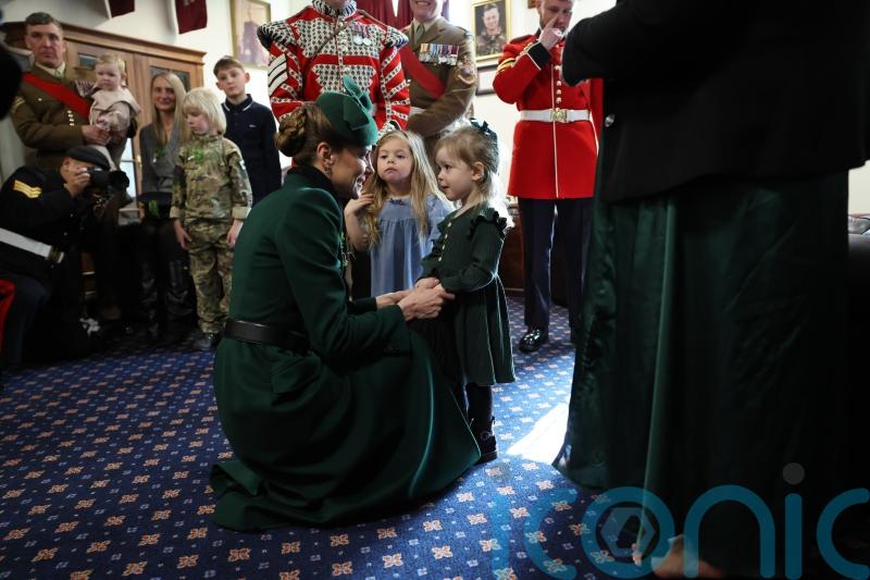 Kate delights little girl as she celebrates St Patrick&rsquo;s Day with Irish Guards