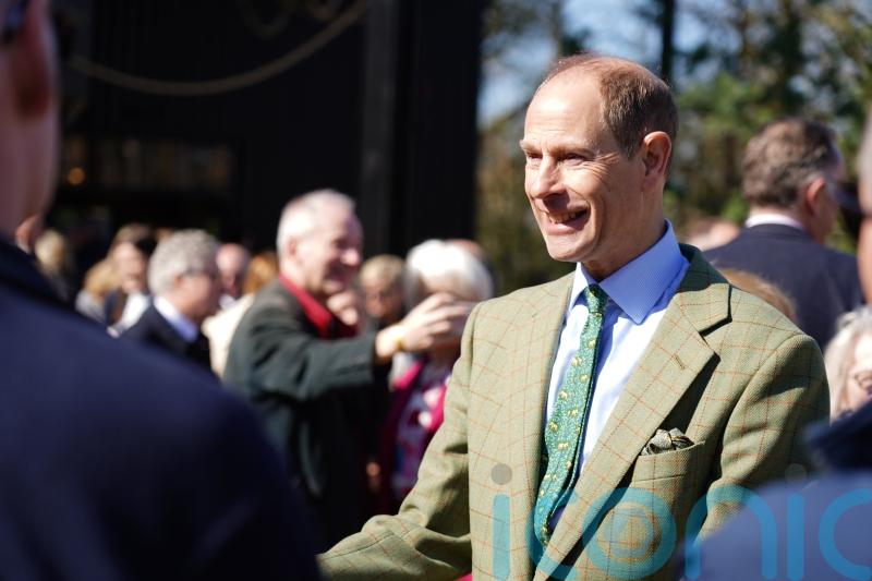 Duke of Edinburgh goes behind the scenes at zoo to prepare gorilla food