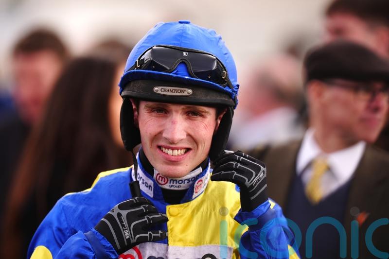 Cobden making sure he is clued up on Irish racing action