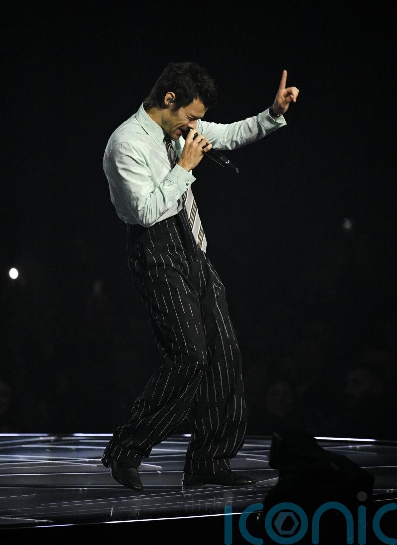 Harry Styles remains at number one on album chart for a second week