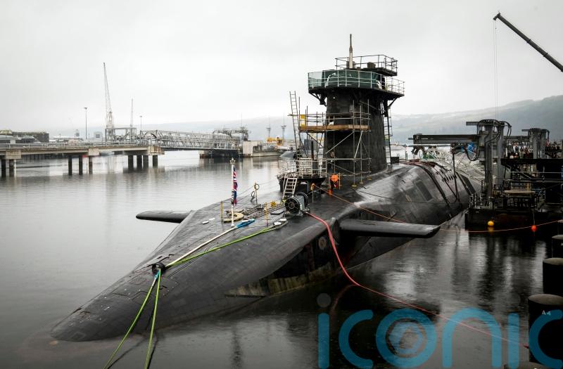 Iranian man and Romanian woman charged after submarine base incident