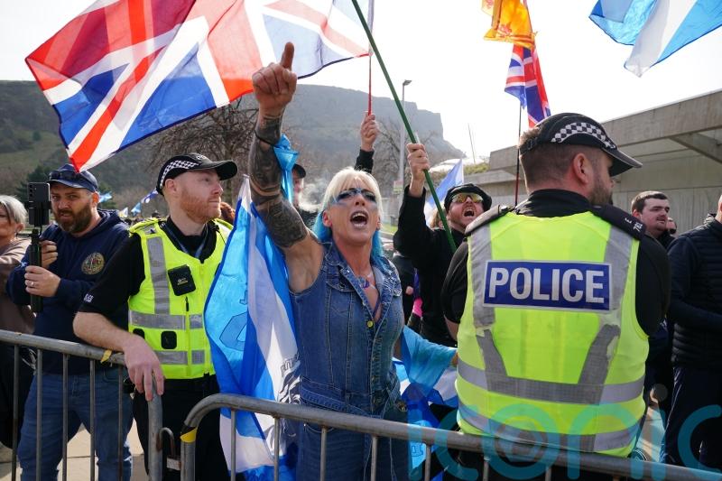 Police keep opposing groups apart as anti-immigration rally held at Holyrood