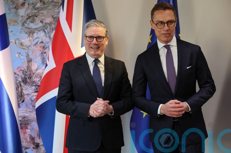 West facing &lsquo;war on two fronts&rsquo;, Starmer warns at defence summit