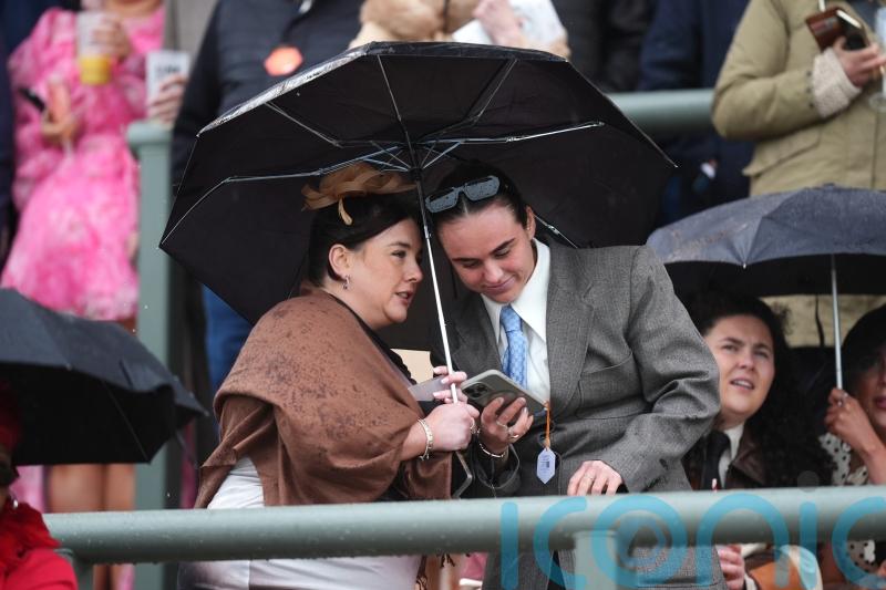 Crowds brave the elements at Aintree ahead of Grand National