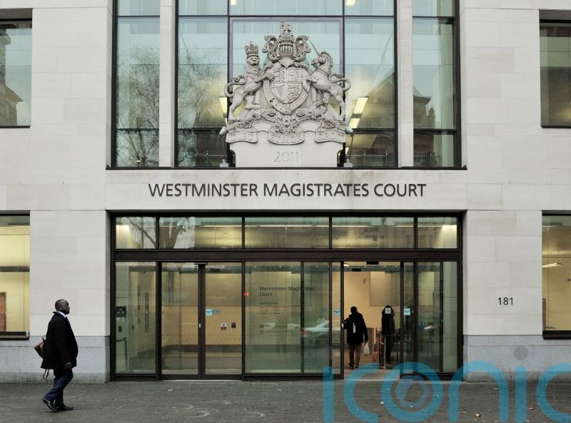 X Factor finalist facing attempted murder charge makes heart sign from dock