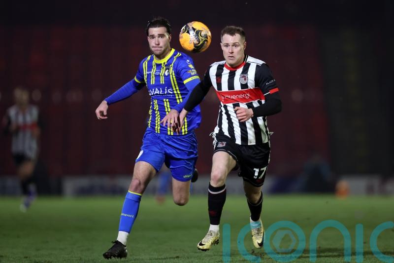 Cameron McJannet grabs stoppage-time winner as Grimsby beat Cambridge