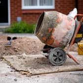 Cement mixer outside a house stock image