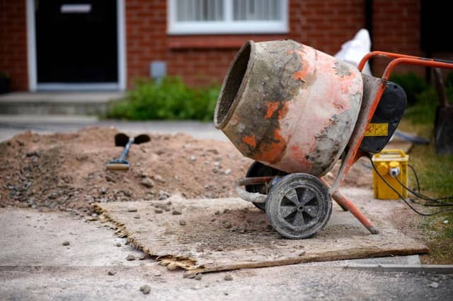 Cement mixer outside a house stock image