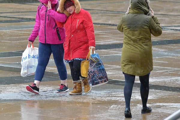 People in Guildhall Square during a previous storm. DER0220GS – 007